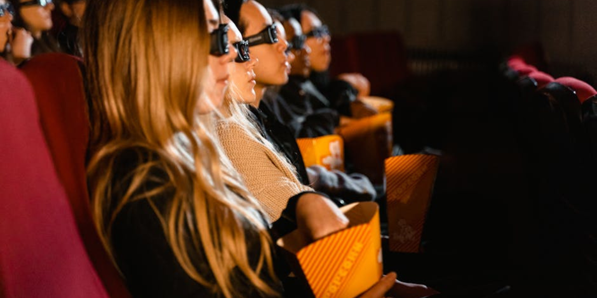 audience watching film in cinema with dramatic lighting