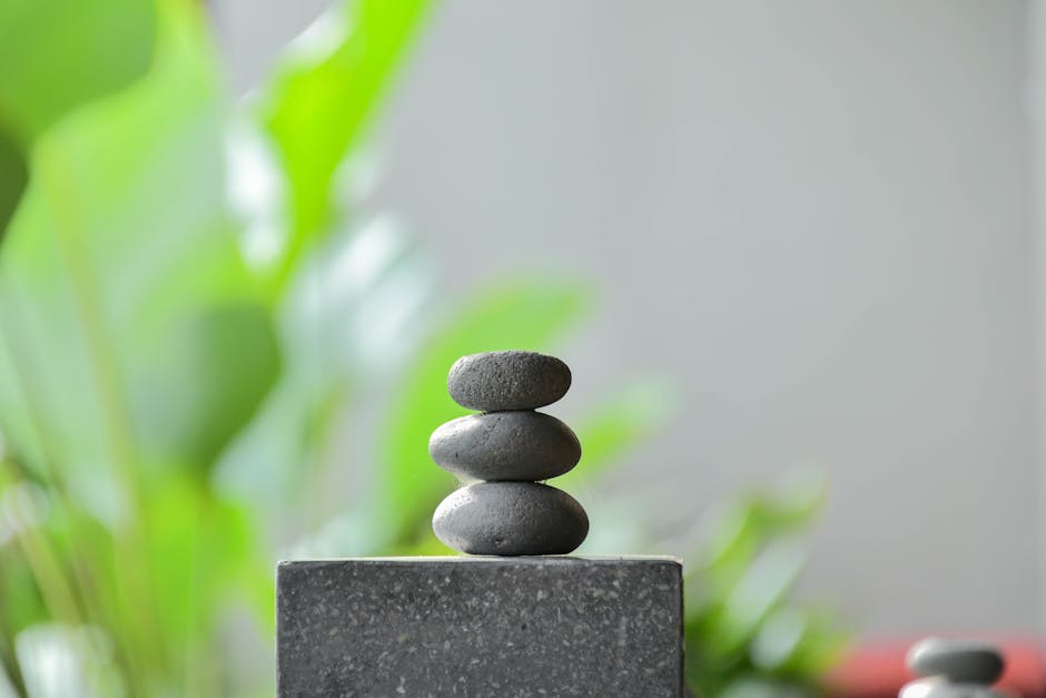 stacked stones representing balance and stability in a calm environment